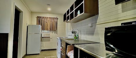 Deluxe Suite | Private kitchen | Full-size fridge, microwave, coffee/tea maker, toaster