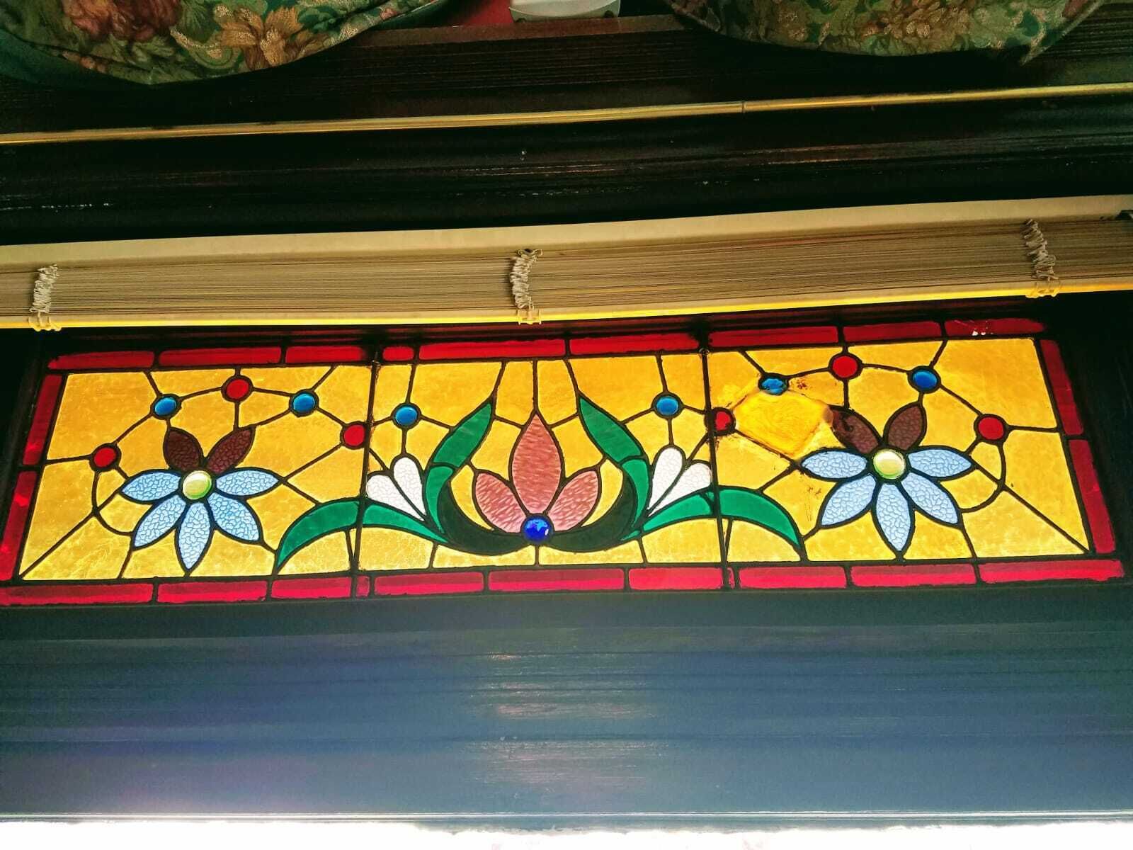 A stained glass window with floral designs.