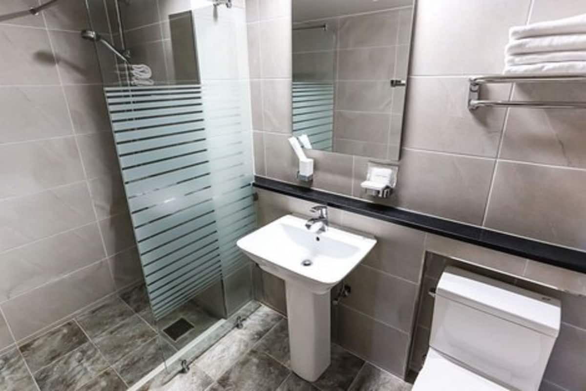 deluxe triple room, mountain view | bathroom | shower, free toiletries, hair dryer, slippers