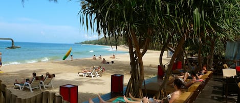 On the beach, sun loungers, beach umbrellas, beach towels