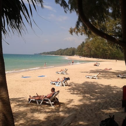 On the beach, sun loungers, beach umbrellas, beach towels