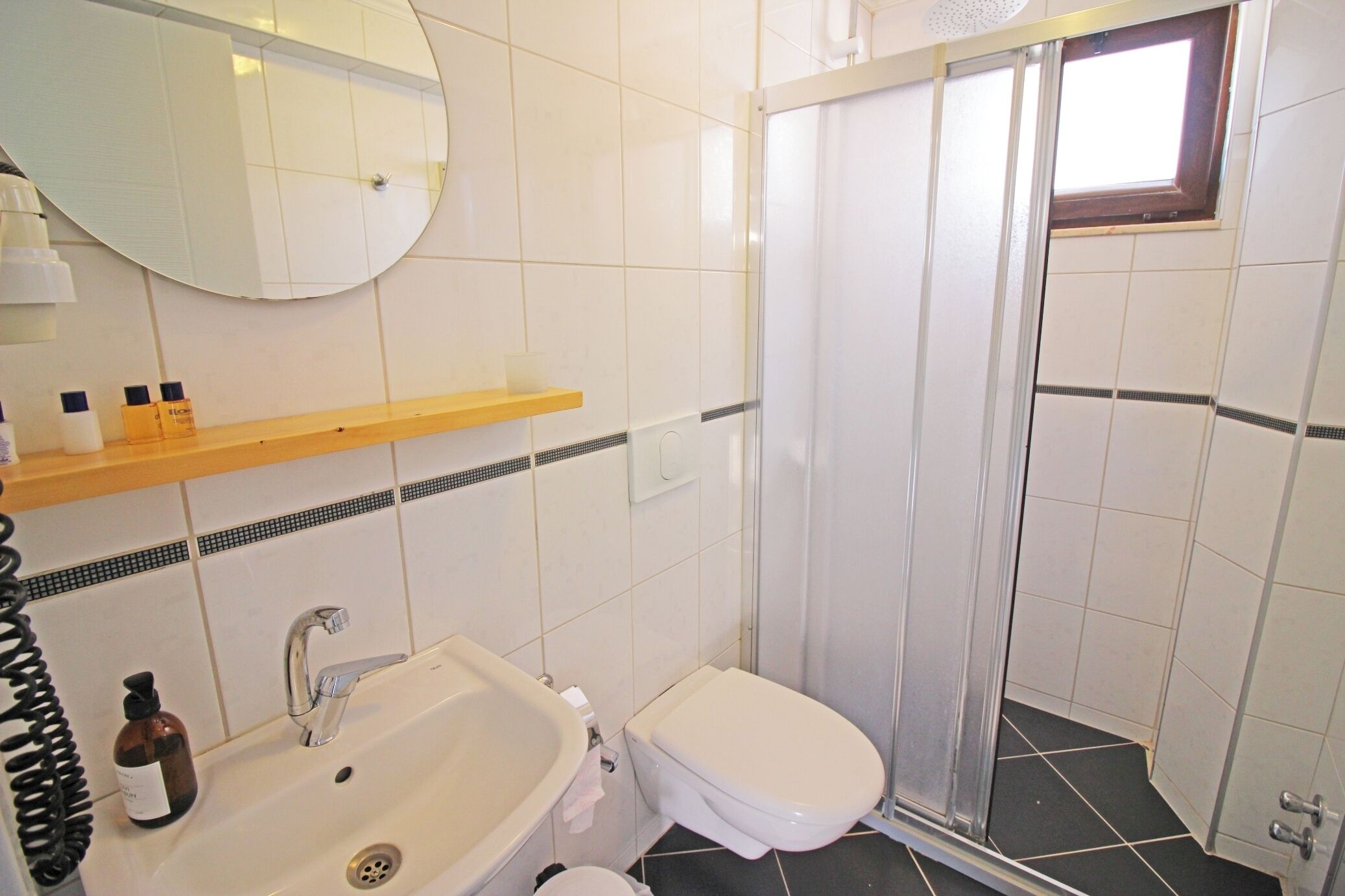 standard double room | bathroom | shower, hair dryer, slippers, towels