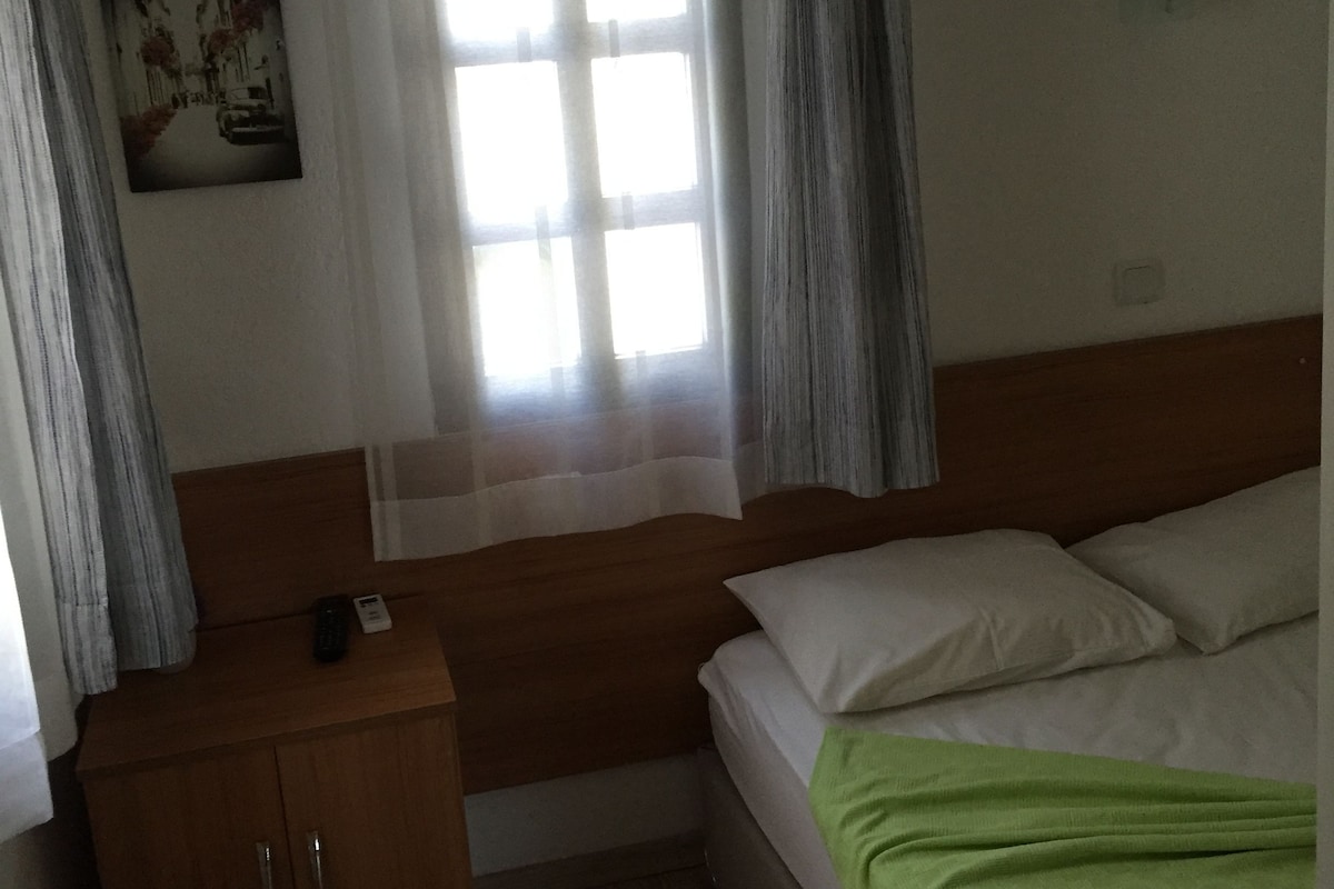 Premium bedding, blackout curtains, iron/ironing board (on request)