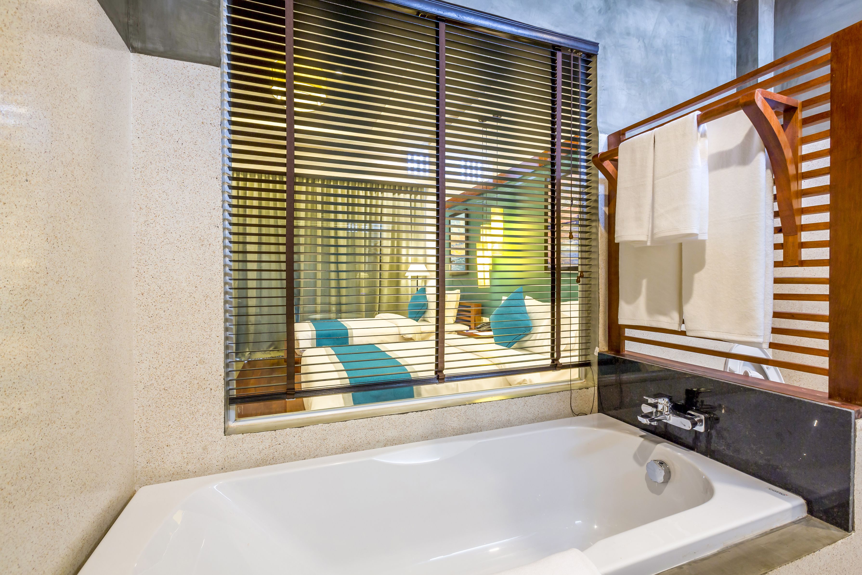 landmark suite twin bed - pool view | bathroom | free toiletries, hair dryer, bathrobes, slippers
