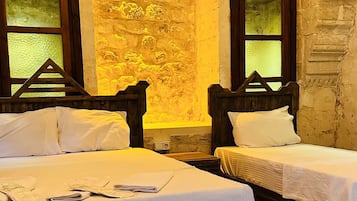 Standard Quadruple Room | Premium bedding, minibar, individually decorated, individually furnished