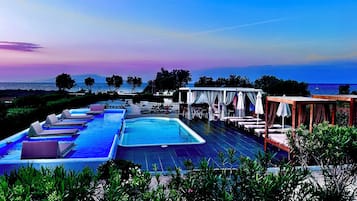 Seasonal outdoor pool, open 7:00 AM to 9:00 PM, pool umbrellas