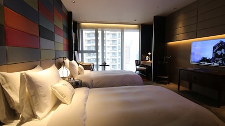 Premium bedding, down comforters, free minibar, in-room safe