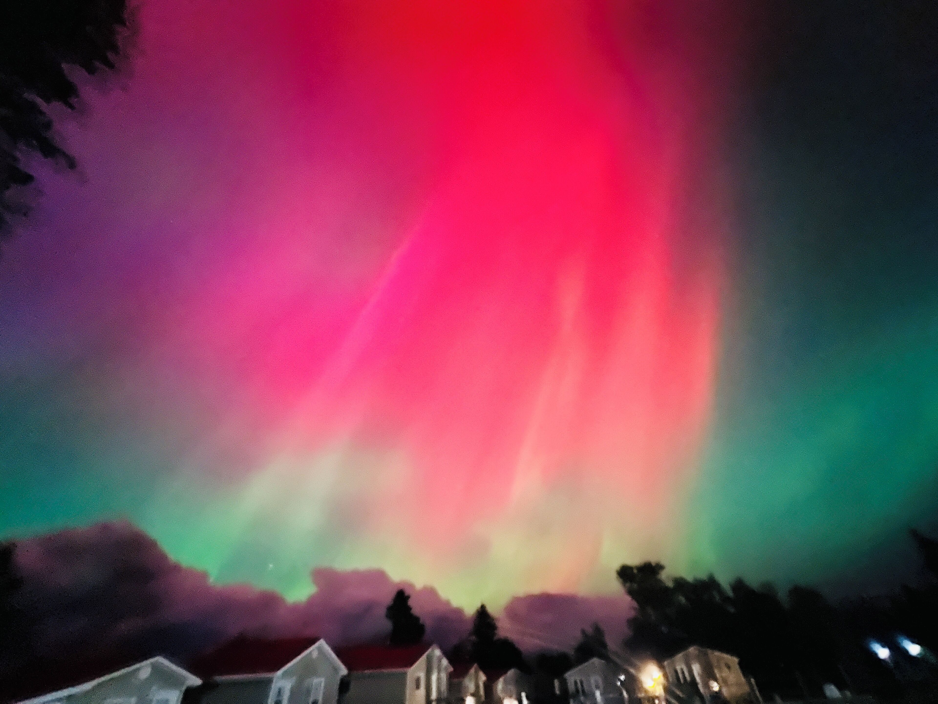 A night sky with a colorful aurora display.