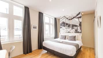 Habitación Deluxe con 1 cama matrimonial o 2 individuales | Ropa de cama de alta calidad y minibar