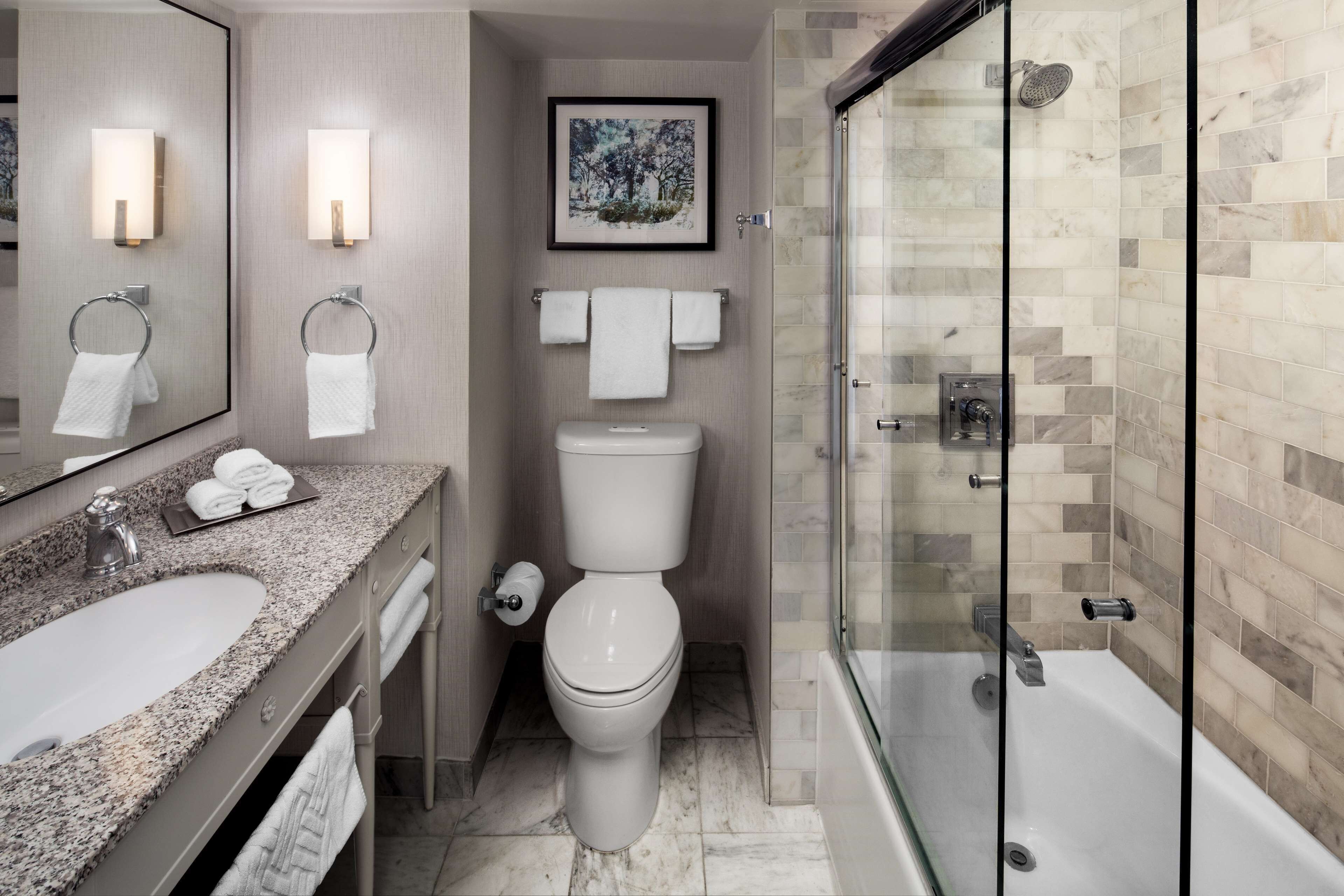 designer toiletries, hair dryer, towels