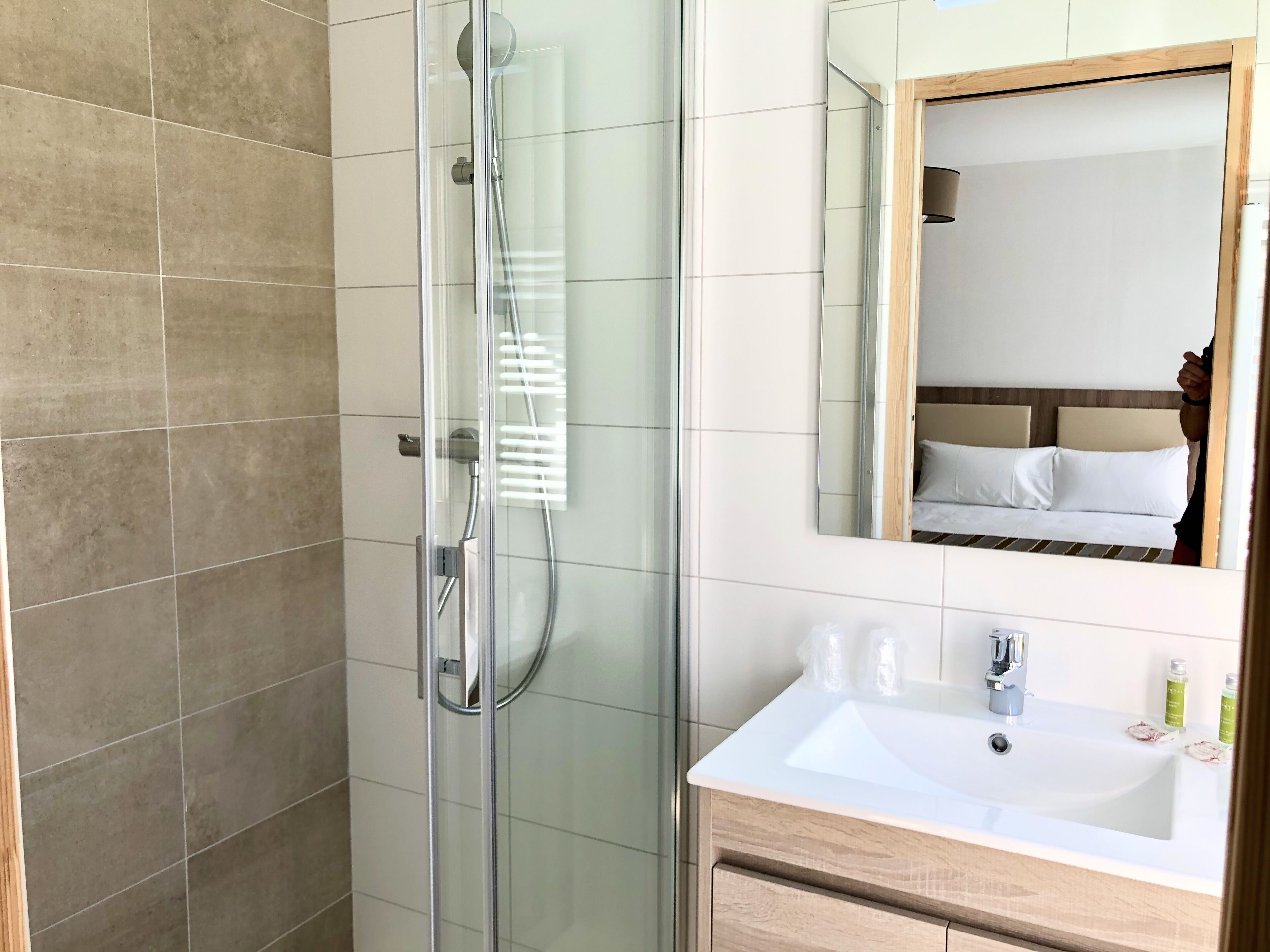superior double room | bathroom | shower, free toiletries, hair dryer, towels
