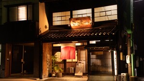 A traditional Japanese building with a wooden exterior, a tiled roof, and a red lantern hanging outside. - Four Points Flex by Sheraton Kanazawa (Kanazawa)