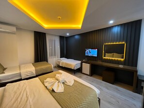 Deluxe Room | Living area | 82-inch LCD TV with satellite channels, TV, iPod dock - Grand Ezel Hotel (Mersin)