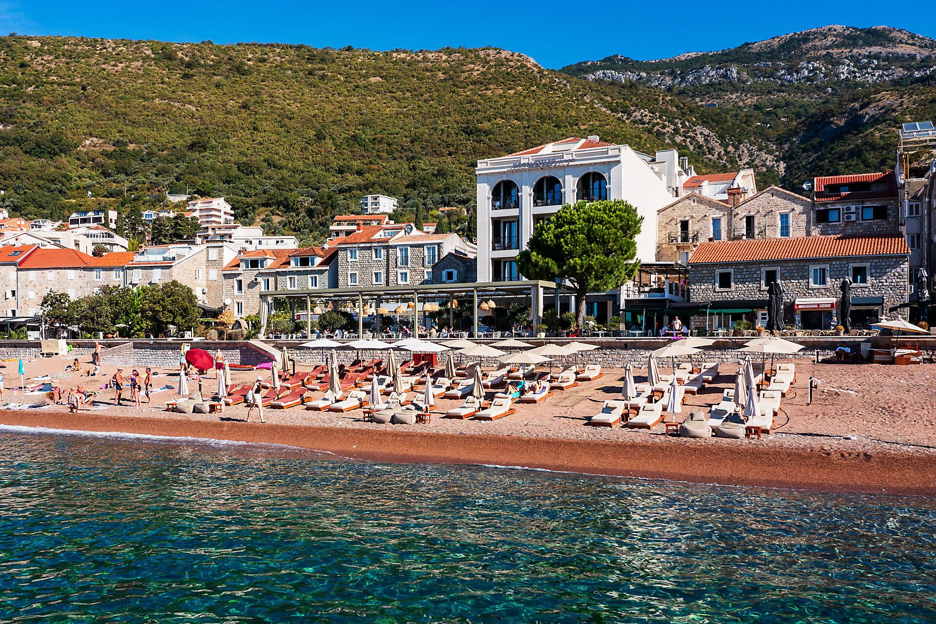 On the beach, sun loungers, beach umbrellas, beach towels