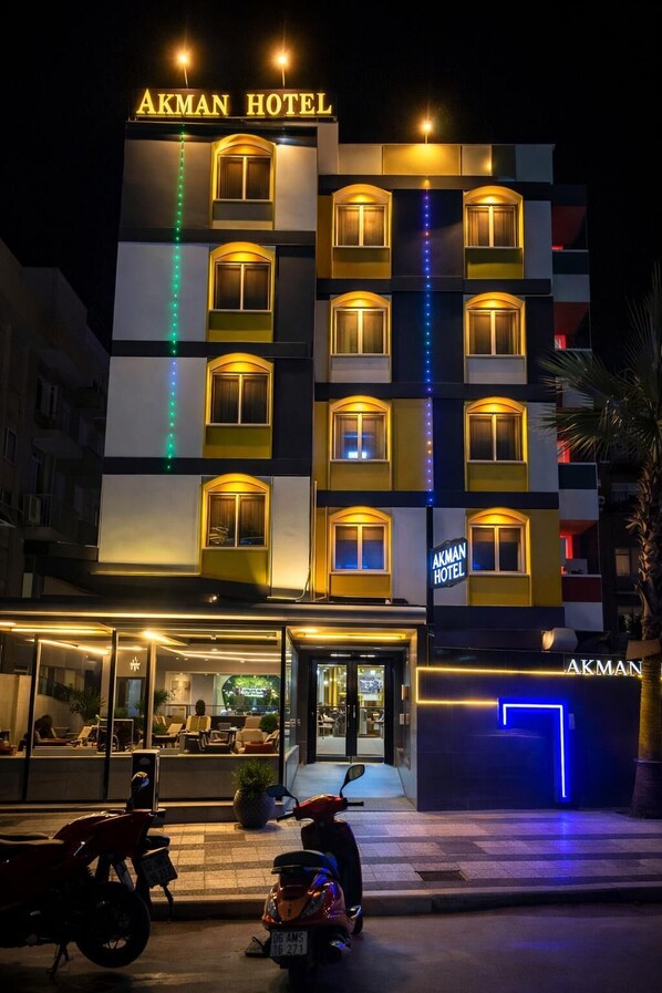 A multi-story building with the sign 'AKMAN HOTEL' at the top. - AKMAN CITY HOTEL (Kusadasi)