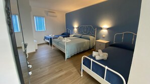 Kamar Quadruple Superior | Seprai premium, minibar, meja kerja, dan kedap suara