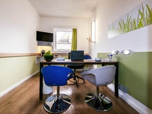 Hypo-allergenic bedding, desk, laptop workspace, blackout drapes