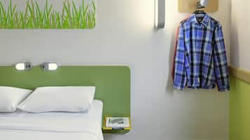 Hypo-allergenic bedding, desk, laptop workspace, blackout drapes