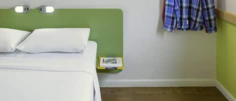 Hypo-allergenic bedding, desk, laptop workspace, blackout curtains