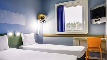 Standard Apartment, 2 Single Beds | Desk, blackout curtains, iron/ironing board, free WiFi