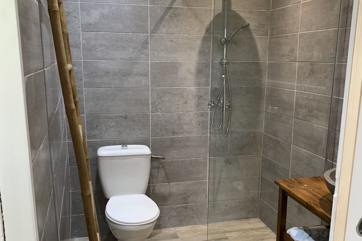 studio, beach view (bungalow 3 pax) | bathroom | shower, free toiletries, hair dryer, towels