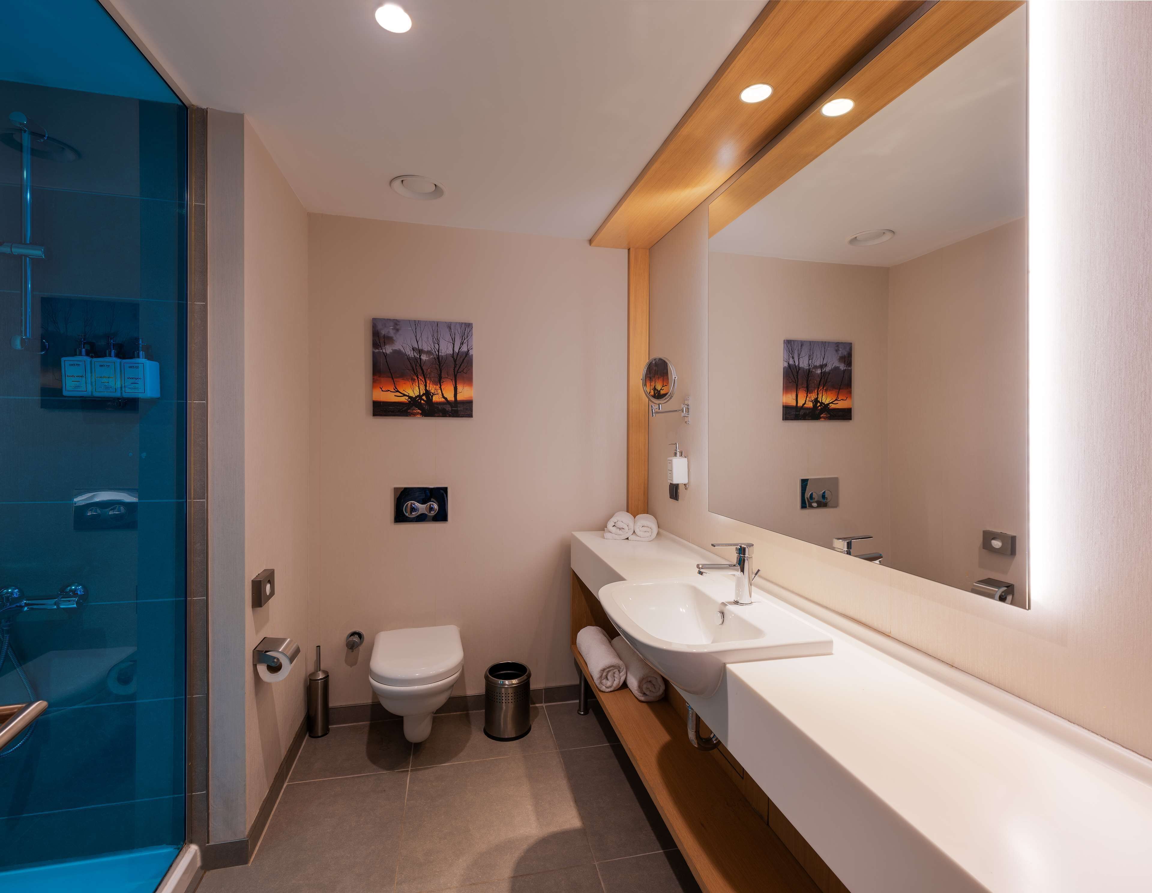 superior room | bathroom | shower, eco-friendly toiletries, hair dryer, bathrobes