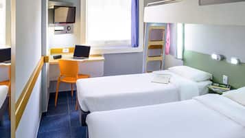 A hotel room with two beds, a desk with a laptop, a chair, and a ladder.