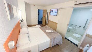 Standard Room, Multiple Beds (Adaptado - PNE) | Minibar, desk, laptop workspace, blackout drapes