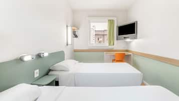 Economy Single Room, 2 Single Beds, City View | Individually decorated, desk, laptop workspace, blackout curtains