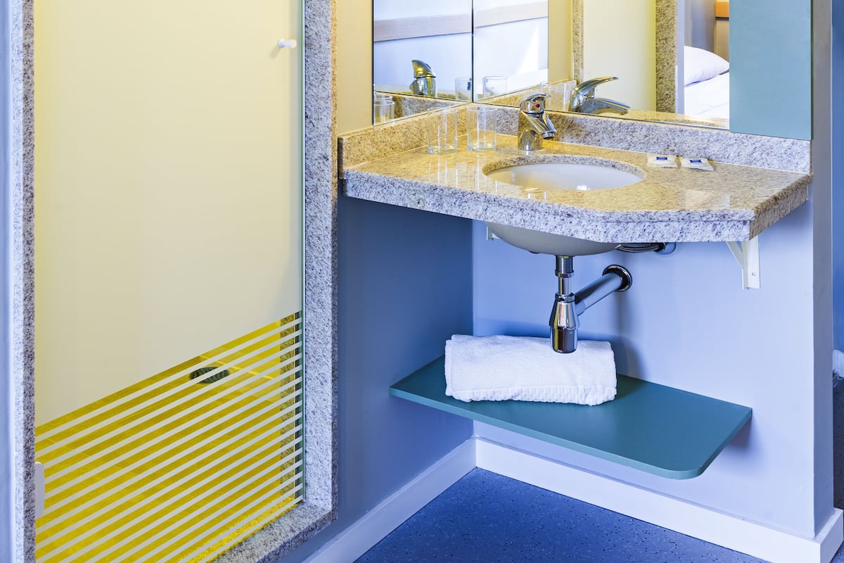 Shower, eco-friendly toiletries, hair dryer, towels