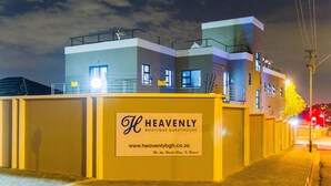 A building with a sign that reads "Heavenly Boutique Guesthouse" and a website address. - Heavenly Boutique Guesthouse (Johannesburg South)