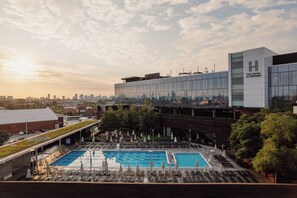 A hotel with a rooftop pool and a city skyline view. - The Hotel at Midtown (Chicago)