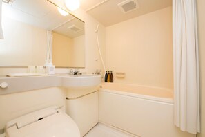 A bathroom with a toilet, sink, and bathtub. - Hotel Nanvan Hamanako (Kosai)