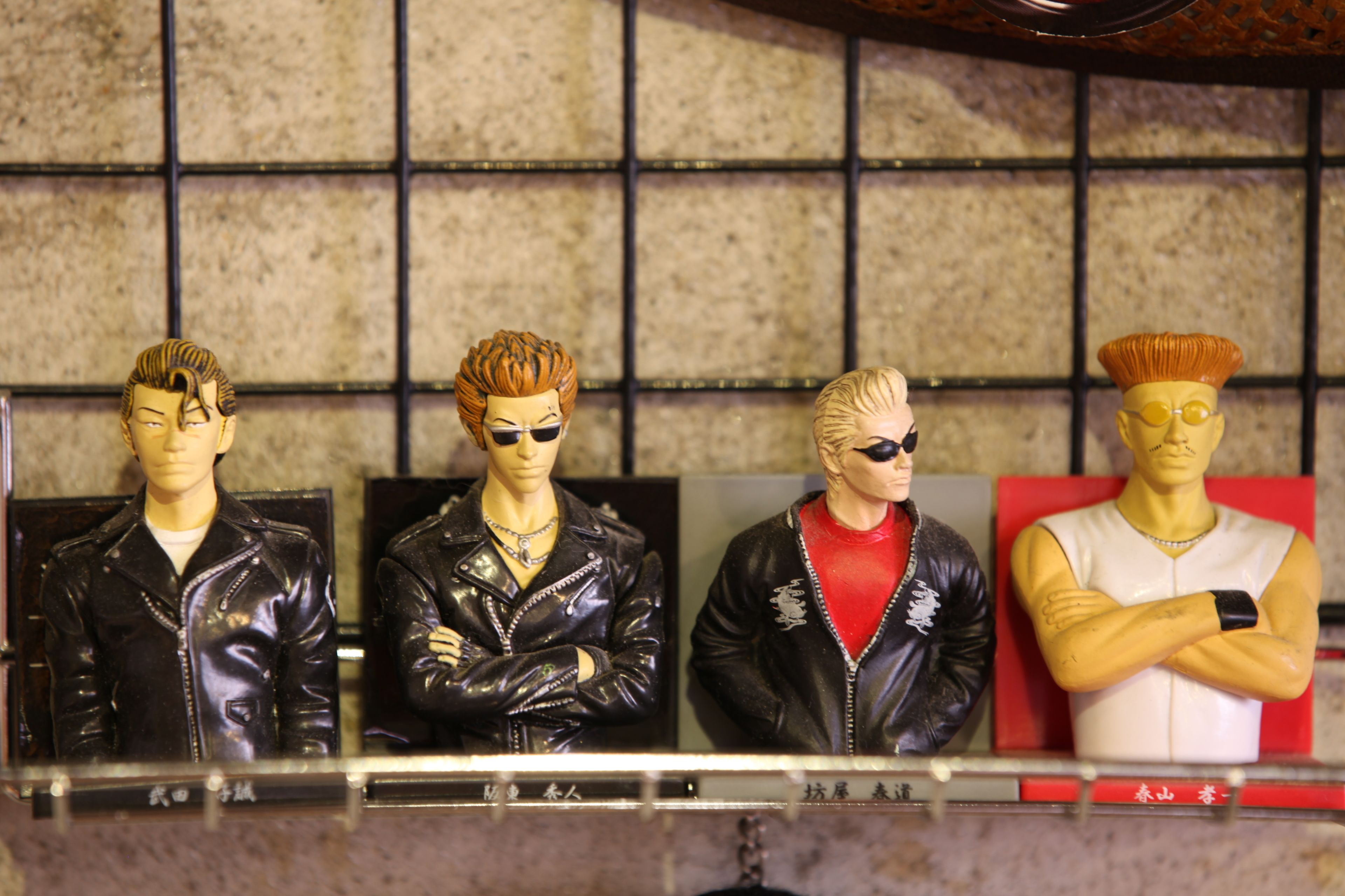 Four mannequins in different outfits.