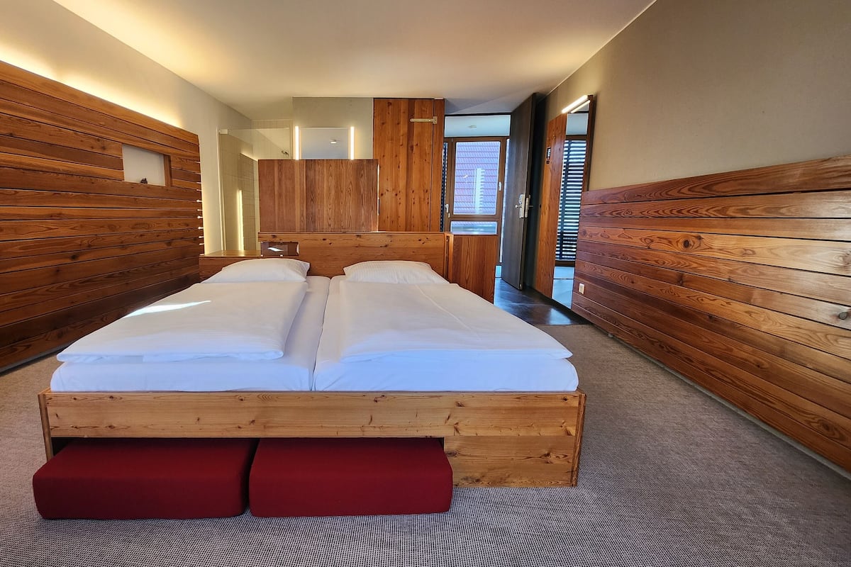 Hypo-allergenic bedding, desk, laptop workspace, blackout curtains