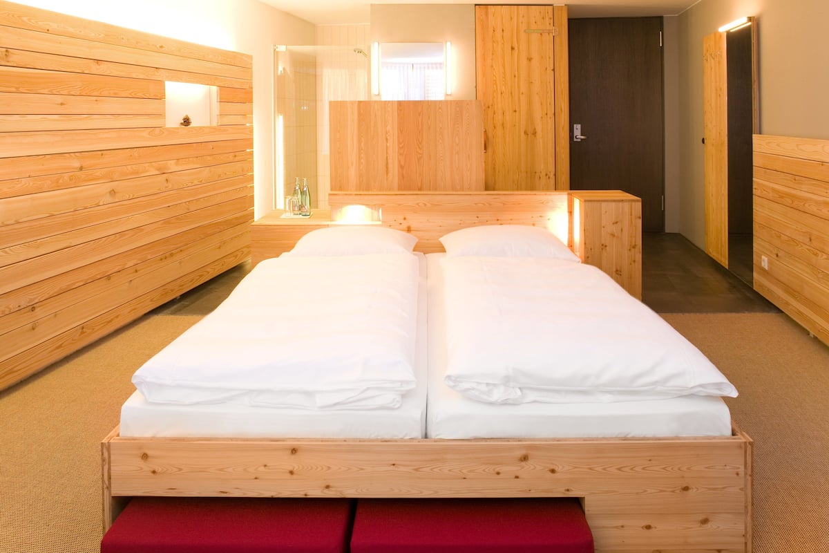 Hypo-allergenic bedding, desk, laptop workspace, blackout curtains