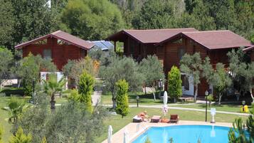 Outdoor pool, open 8:30 AM to 8:00 PM, pool umbrellas, pool loungers