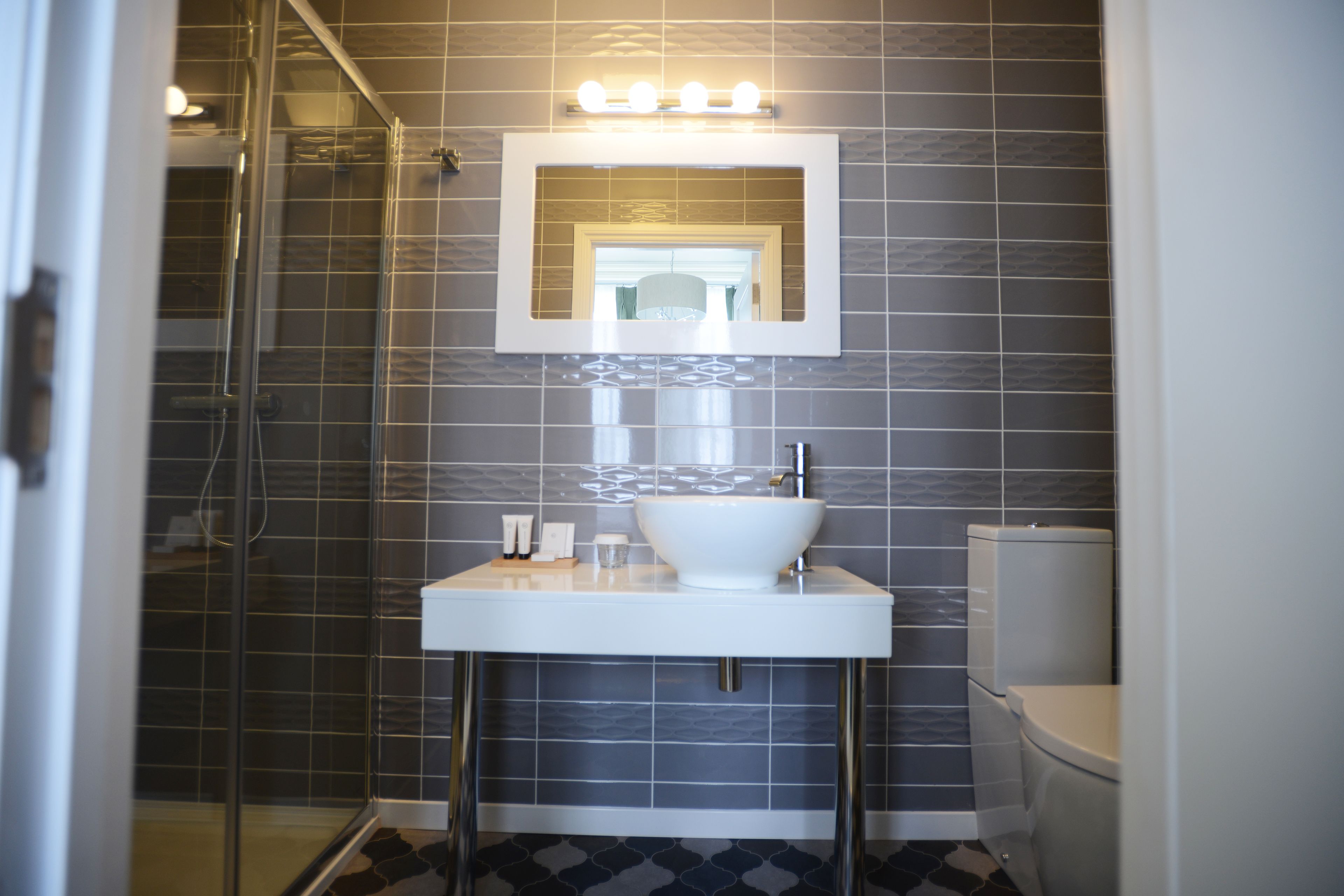 signature suite, sea view | bathroom | shower, free toiletries, bathrobes, slippers