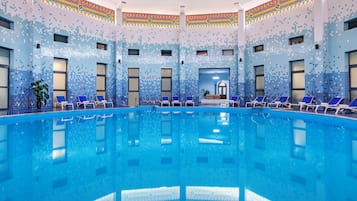 Indoor pool, outdoor pool, pool umbrellas, pool loungers