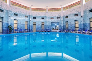 Indoor pool, outdoor pool, pool umbrellas, sun loungers