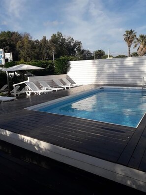 Seasonal outdoor pool, open 8:00 AM to 7:00 PM, sun loungers