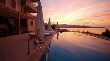 Outdoor pool, pool umbrellas, pool loungers