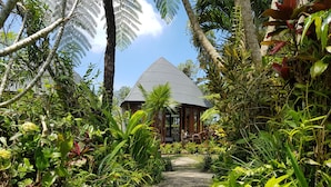A gazebo with a stone pathway leading to it, surrounded by lush tropical vegetation. - Hillside Eden Bali (Payangan)