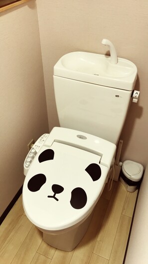 A toilet with a panda face design and a control panel. - SUGIYA Guest House - Hostel (Nara)