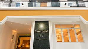 A hotel entrance with a black sign reading "Veovo Hotel." - Veevoo Hotel (Ho Chi Minh City)
