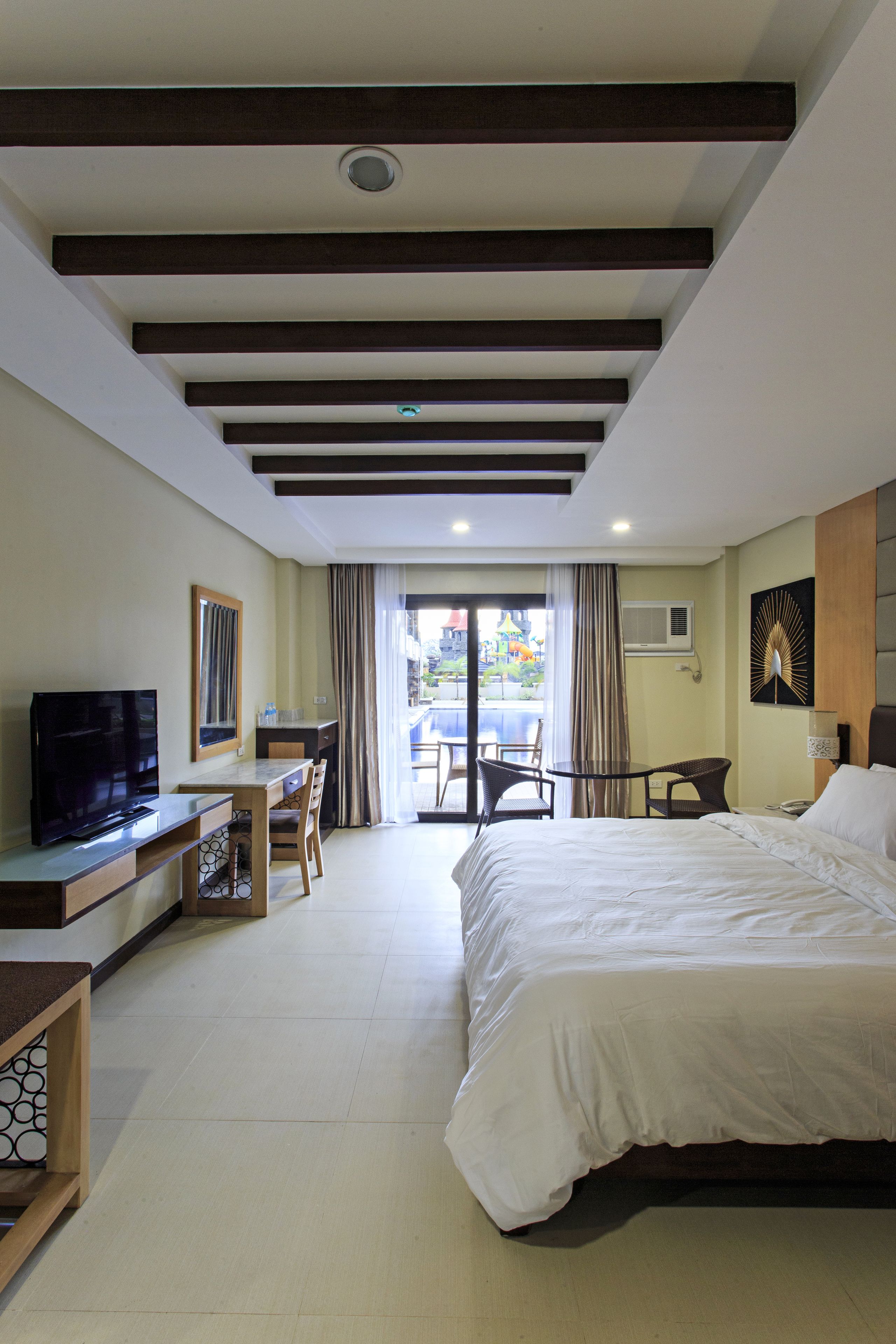 superior king with pool access | in-room safe, desk, wifi, bed sheets