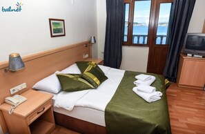 Quarto, vista para o mar | Frigobar, escrivaninha, Wi-Fi de cortesia