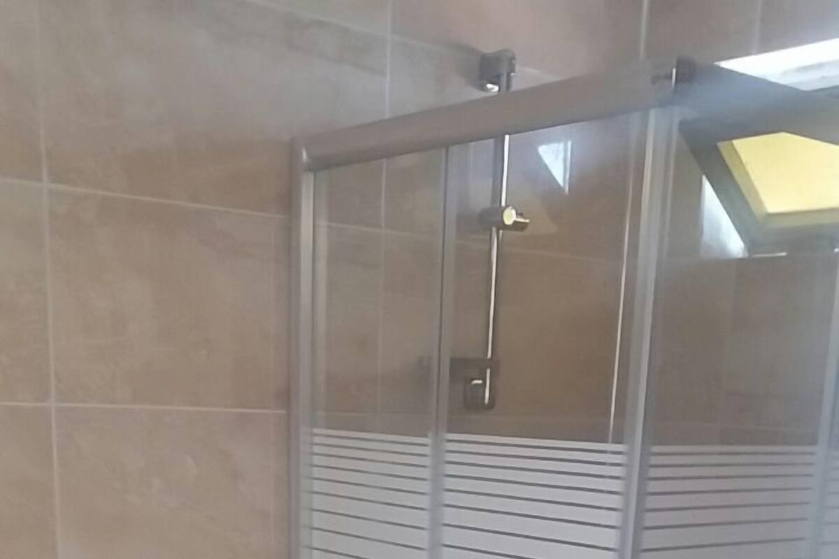 Shower, free toiletries, hair dryer, slippers
