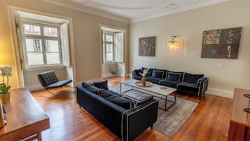 Deluxe 2 Bedroom Apartment | Living area | Flat-screen TV, MP3 dock