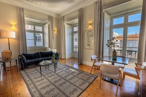 Deluxe 2 Bedroom Apartment with Square View | Living area | Flat-screen TV, MP3 dock